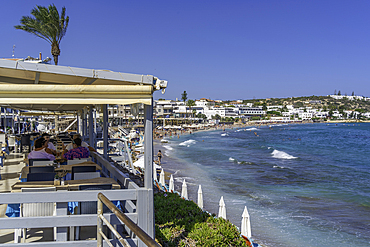 View of taverna and Palmowy Zakątek Beach, Limenas Chersonisou, Crete, Greek Islands, Greece, Europe