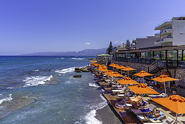 View of sunshades on Limena Chersonisou Beach, Limenas Chersonisou, Crete, Greek Islands, Greece, Europe