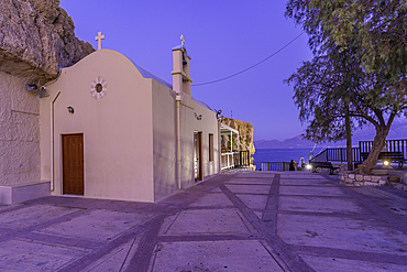 View of Church of Saint Paraskevi in Port of Limenas Chersonisou at dusk, Limenas Chersonisou, Crete, Greek Islands, Greece, Europe