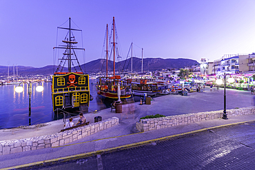 View of boats in Port of Limenas Chersonisou at dusk, Limenas Chersonisou, Crete, Greek Islands, Greece, Europe