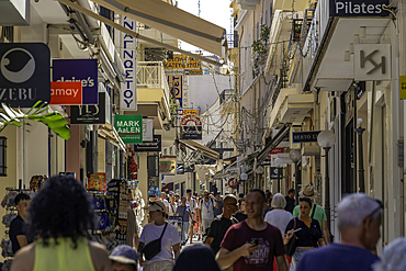 View of busy shopping street in city centre on a sunny day, City of Heraklion, Crete, Greek Islands, Geece, Europe