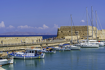 View of Koules Venetian Fortress and boats in Heraklion Venetian Port on a sunny day, City of Heraklion, Crete, Greek Islands, Geece, Europe