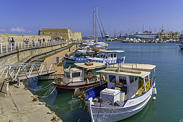 View of Koules Venetian Fortress and boats in Heraklion Venetian Port on a sunny day, City of Heraklion, Crete, Greek Islands, Geece, Europe
