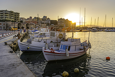 View of boats in Heraklion Venetian Port at sunset, City of Heraklion, Crete, Greek Islands, Geece, Europe