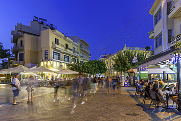View of cafes and bars in city centre at dusk, City of Heraklion, Crete, Greek Islands, Geece, Europe