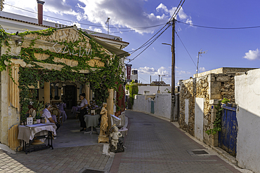 View of taverna on narrow street in Koutouloufari, Crete, Greek Islands, Greece, Europe