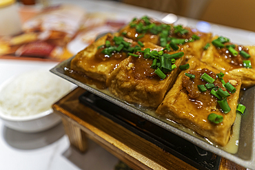 View of pan fried tofu with port, traditional Chinese dish, Hong Kong Island, Hong Kong, China, Asia