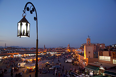 View over market square at dusk, Place Jemaa El Fna, Marrakesh, Morocco, North Africa, Africa