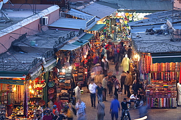 View over market square at dusk, Place Jemaa El Fna, Marrakesh, Morocco, North Africa, Africa