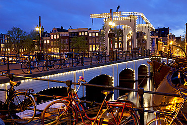 Magere Brug (Skinny Bridge) at dusk, Amsterdam, Holland, Europe
