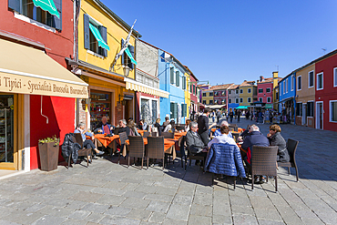 Restaurant and colourful facades, Burano, Veneto, Italy, Europe