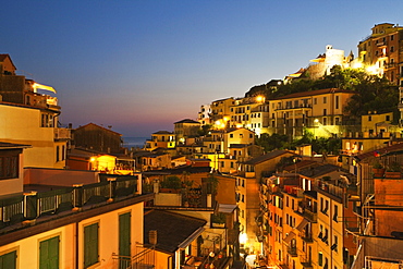 Riomaggiore rooftops and the Castle at dusk, Cinque Terre, UNESCO World Heritage Site, Liguria, Italy, Mediterranean, Europe 