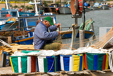 Fisherman mending nets, Potamos Tou Liopetri, Cyprus, Europe