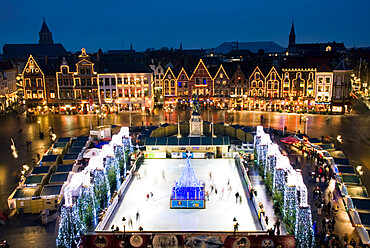 Ice Rink and Christmas Market in the Market Square, Bruges, West Vlaanderen (Flanders), Belgium, Europe