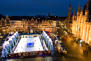 Ice Rink and Christmas Market in the Market Square, Bruges, West Vlaanderen (Flanders), Belgium, Europe