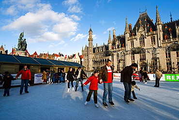 Christmas Ice Rink in the Market Square, Bruges, West Vlaanderen (Flanders), Belgium, Europe