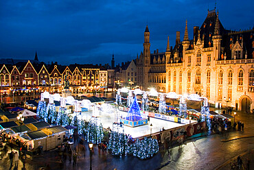 Ice Rink and Christmas Market in the Market Square, Bruges, West Vlaanderen (Flanders), Belgium, Europe