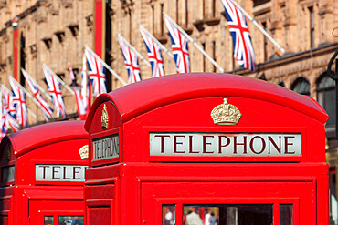 Red telephone boxes opposite Harrod's, Knightsbridge, London, England, United Kingdom, Europe