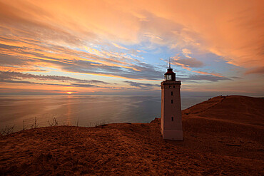 Rubjerg Knude Fyr (lighthouse) buried by sand drift at sunset, Lokken, Jutland, Denmark, Scandinavia, Europe