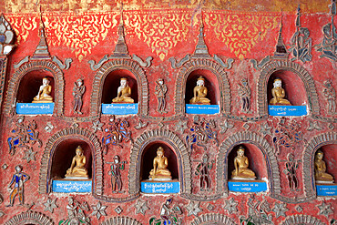 Buddha offerings in wall niche, Shwe Yan Pyay monastery, Nyaungshwe, Inle Lake, Shan State, Myanmar (Burma), Asia