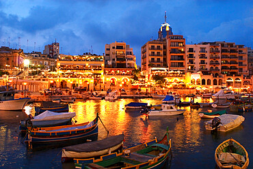 Evening across Spinola Bay with restaurants, St. Julian`s, Malta, Mediterranean, Europe