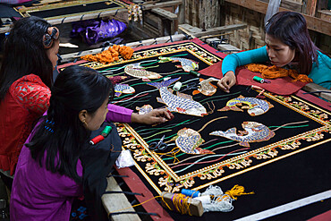 Local women working on hand embroidered tapestry, Mandalay, Myanmar (Burma), Asia