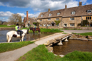 The Old Mill Museum and stone bridge over River Eye, Lower Slaughter, Cotswolds, Gloucestershire, England, United Kingdom, Europe