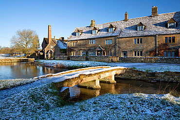 Stone bridge and Cotswold cottages in snow, Lower Slaughter, Cotswolds, Gloucestershire, England, United Kingdom, Europe