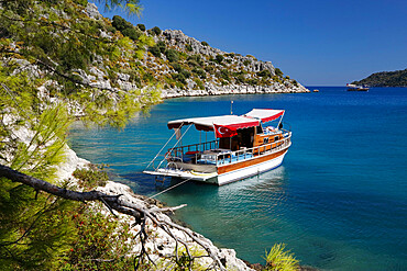 Small gulet boat in craggy cove, Kekova, near Kas, Lycia, Antalya Province, Mediterranean Coast, Southwest Turkey, Turkey, Asia Minor, Eurasia