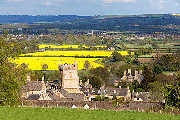 St. Lawrence church and oilseed rape fields, Bourton-on-the-Hill, Cotswolds, Gloucestershire, England, United Kingdom, Europe