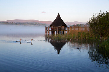 Llangorse Lake and Crannog Island in morning mist, Llangorse, Brecon Beacons National Park, Powys, Wales, United Kingdom, Europe