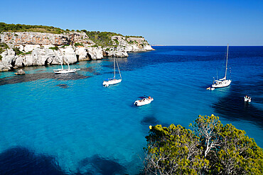 Yachts anchored in cove, Cala Macarella, near Cala Galdana, South West Coast, Menorca, Balearic Islands, Spain, Mediterranean, Europe