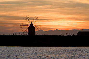 Sunset over windmill on salt beds, Trapani, Sicily, Italy, Mediterranean, Europe