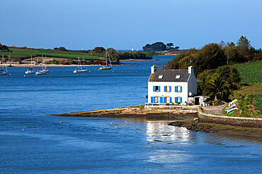 Typical French cottage on Penze estuary viewed from Pont de la Corde, near Carantec, Finistere, Brittany, France, Europe