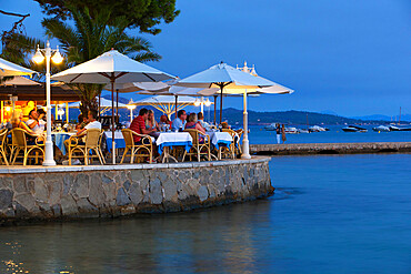 Waterfront restaurant in the evening, Port de Pollenca (Puerto Pollensa), Mallorca (Majorca), Balearic Islands, Spain, Mediterranean, Europe