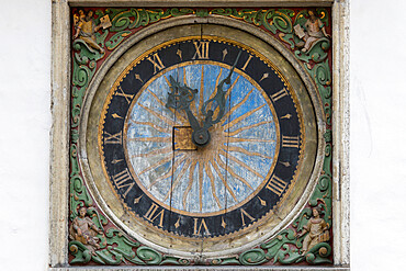 The 17th century clock with golden sun motif on facade of the Church of the Holy Ghost, Old Town, UNESCO World Heritage Site, Tallinn, Estonia, Europe