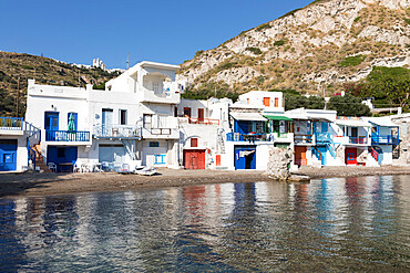 Colourful fishermen's boat houses with Plaka on hill, Klima, Milos, Cyclades, Aegean Sea, Greek Islands, Greece, Europe