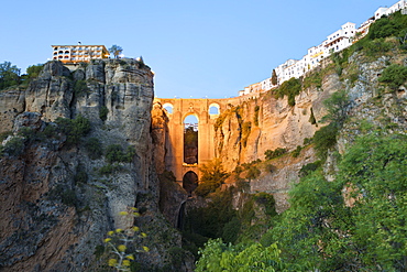 Puente Nuevo (New Bridge) floodlit at night and the white town perched on cliffs, Ronda, Andalucia, Spain, Europe