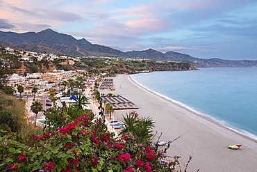 Sunset view over Nerja Playa Burriana beach, Nerja, Malaga Province, Costa del Sol, Andalucia, Spain, Europe