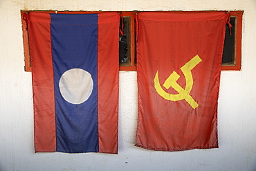 Laos National and Lao People's Revolutionary Party (LPRP) flags, Nong Khiaw, Northern Laos, Laos, Indochina, Southeast Asia, Asia