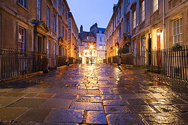 Wet paving stones and Georgian houses along the North Parade buildings, Bath, UNESCO World Heritage Site, Somerset, England, United Kingdom, Europe