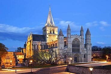 The west front of the Norman built Rochester Cathedral floodlit at night, Rochester, Kent, England, United Kingdom, Europe