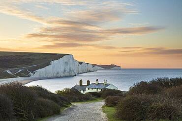 Seven Sisters and Beachy Head with coastguard cottages at sunrise in spring, Seaford Head, East Sussex, England, United Kingdom, Europe