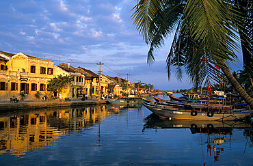 View of old town and fishing boats along Thu Bon River, Hoi An, UNESCO World Heritage Site, South Central Coast, Vietnam, Indochina, Southeast Asia, Asia