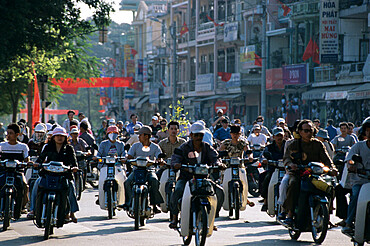 Busy city street filled with mopeds, Hue, North Central Coast, Vietnam, Indochina, Southeast Asia, Asia