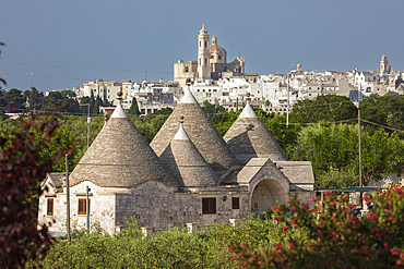 Locorotondo town and Chiesetta rettoria Maria SS Annunziata church on hilltop with trulli house below in the Valle d Itria, Locorotondo, Puglia, Italy, Europe