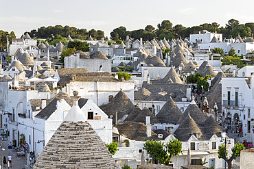 View over conical stone roofs of traditional trulli houses in the old town, Alberobello, Puglia, Italy, Europe