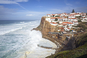 Atlantic Ocean waves breaking below cliffs of Azenhas do Mar on the west coast, Azenhas do Mar, Lisbon Region, Portugal, Europe