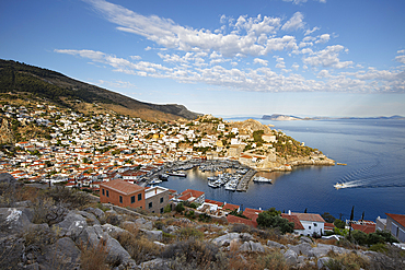 View over the port and whitewashed houses on hillside, Hydra, Saronic Islands, Greek Islands, Greece, Europe