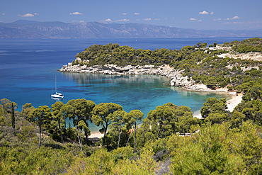 Agia Paraskevi beach with yacht anchored in bay, Spetses, Saronic Islands, Greek Islands, Greece, Europe
